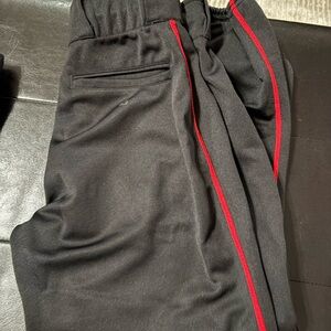 Women's Black Softball pants with Red Stripe. Size small.